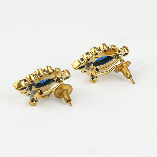 Angled view of Brass Fashion Earrings highlighting the unique silhouette, structure, and polished brass finish