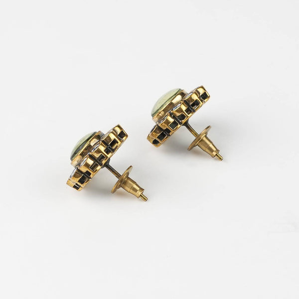 Angled view of Brass Fashion Earrings highlighting the unique silhouette, structure, and polished brass finish