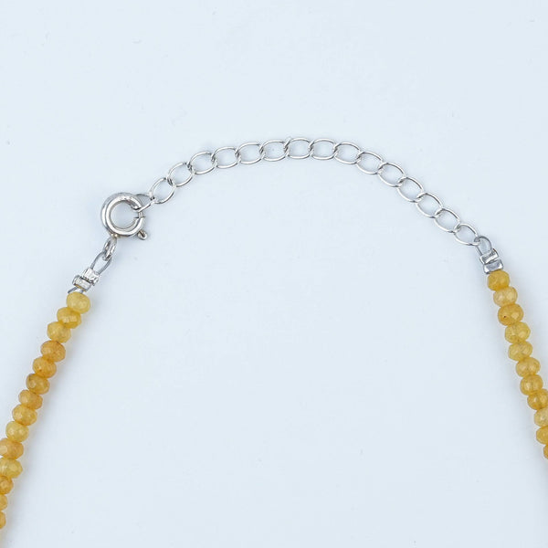 Close-up of Flower & Pearl Charm Necklace with Yellow Jade showcasing floral charms, lustrous pearls, and natural yellow jade
