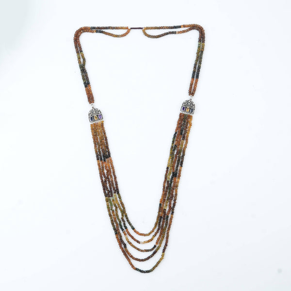Flat-lay of Silver Tourmaline Layered Necklace with natural tourmaline stones and complementary silver jewellery