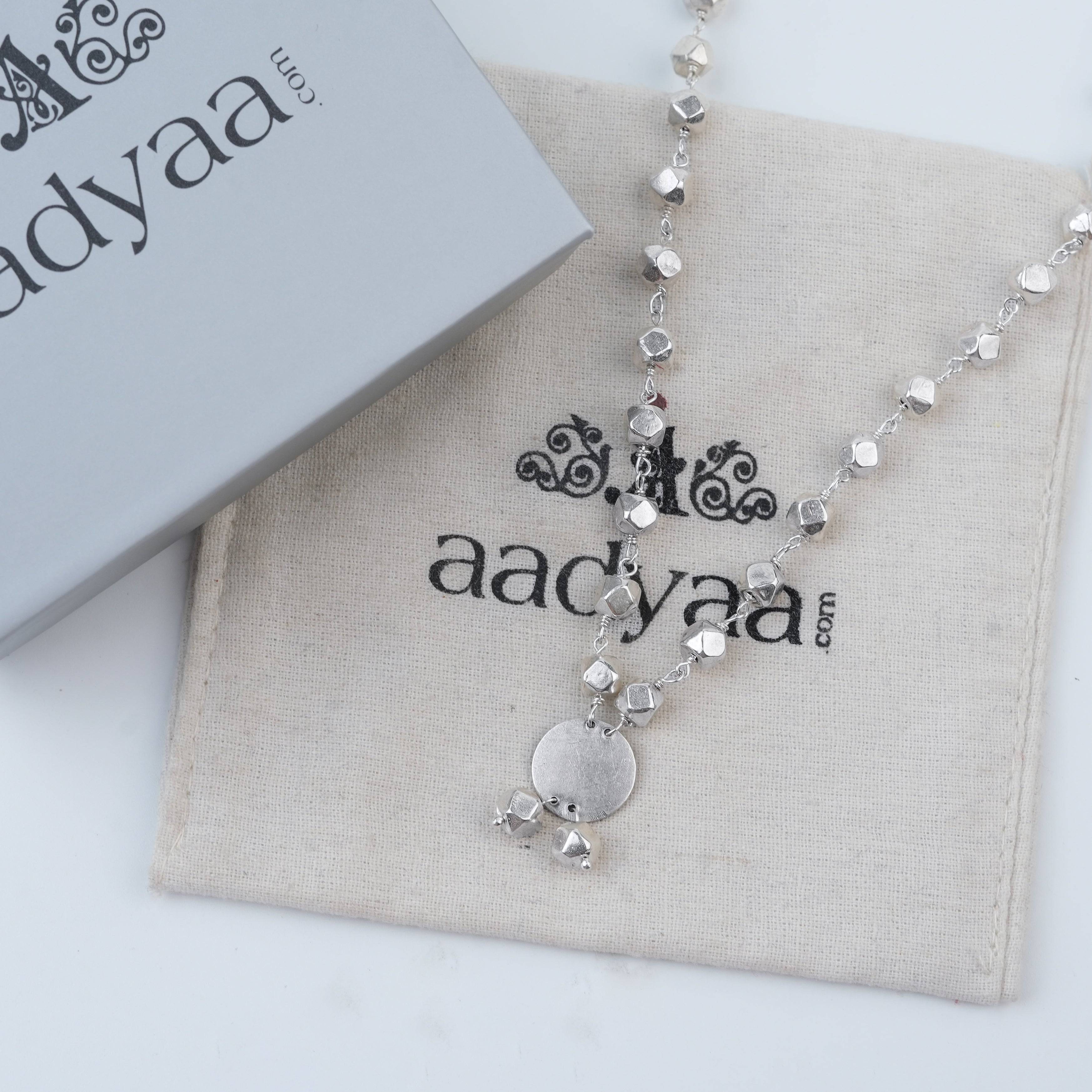 Detailed view of Ashtapailu Necklace with Plain Coin Pendant (Small) highlighting the smooth coin pendant, delicate beadwork, and polished silver finish