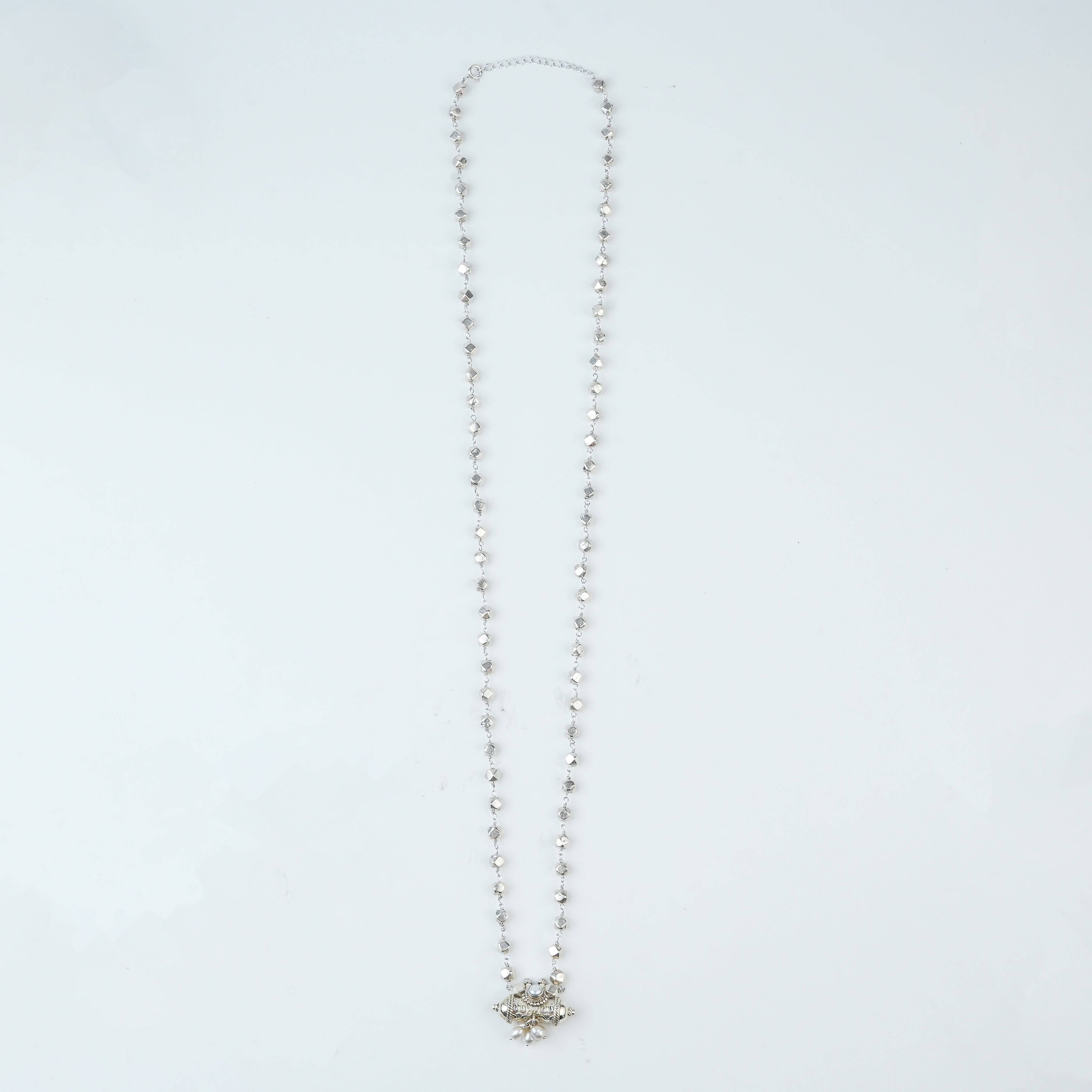 Flat-lay of Ashtapailu Necklace with Tait Pendant with traditional jewellery and elegant festive accessories