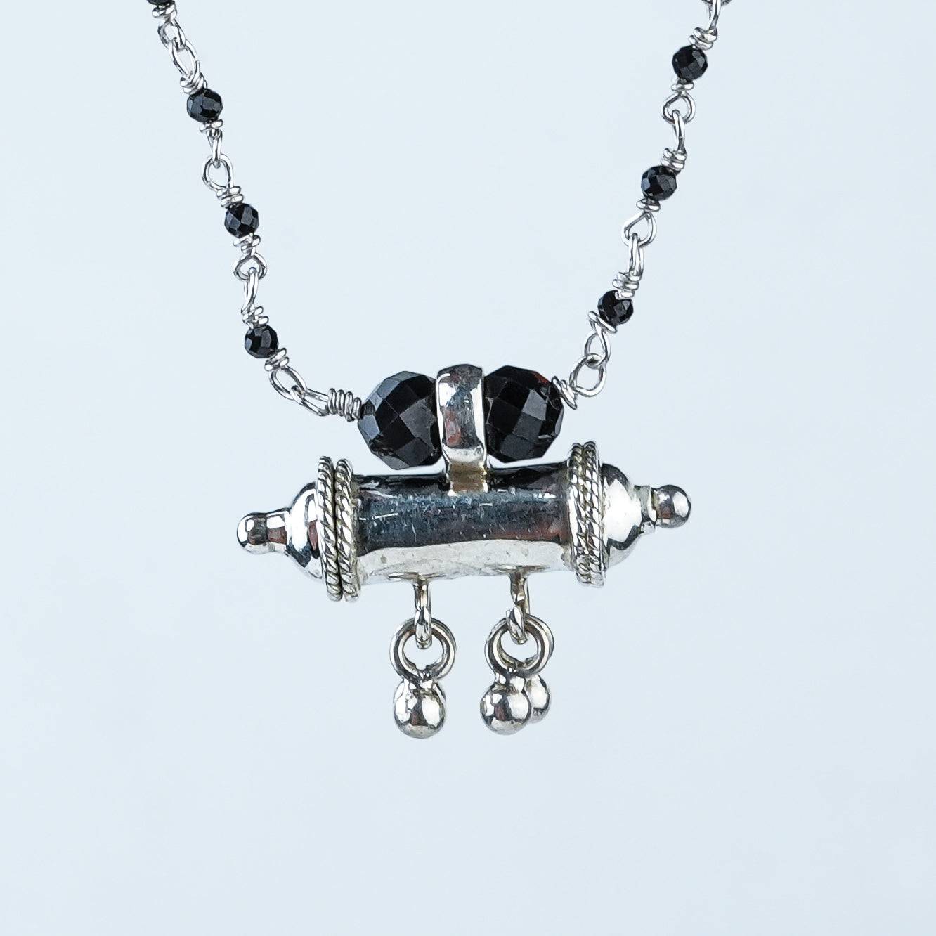 Close-up of Black Spinel Ganthan Necklace with Tait Pendant showcasing black spinel beads, intricate Ganthan work, and fine silver craftsmanship