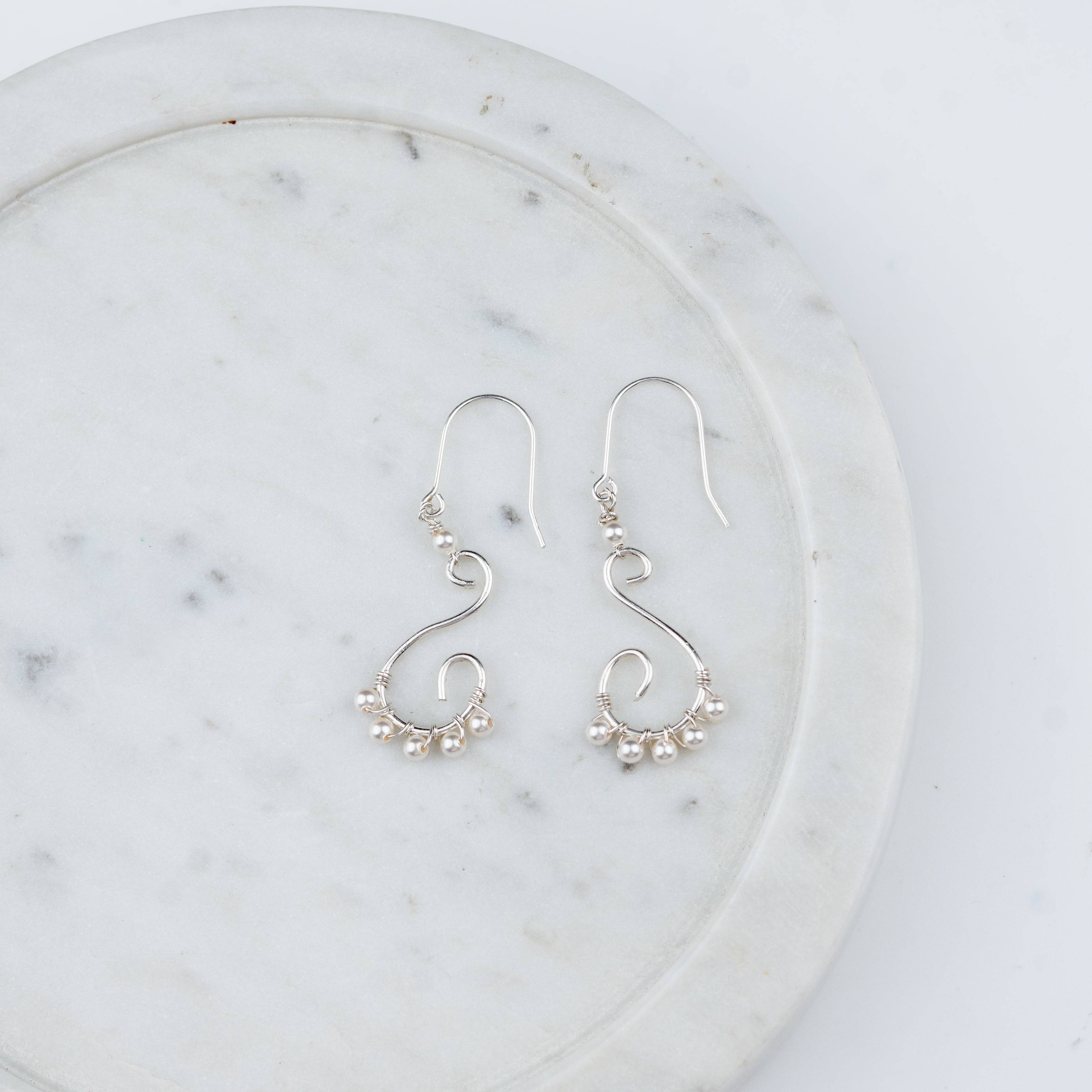Intricate handmade pearl and silver earrings
