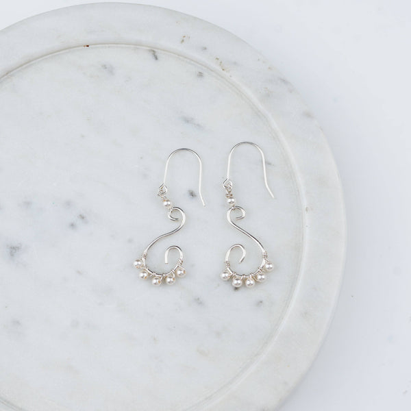 Intricate handmade pearl and silver earrings