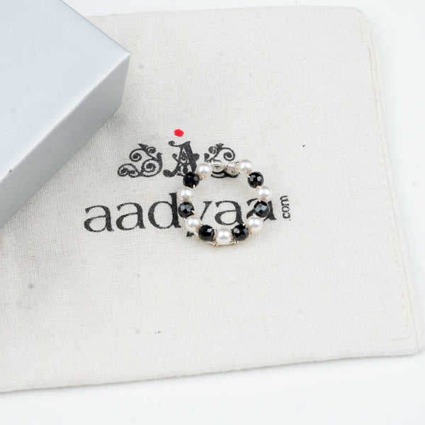 Sterling silver ring with black spinel and pearl detailing