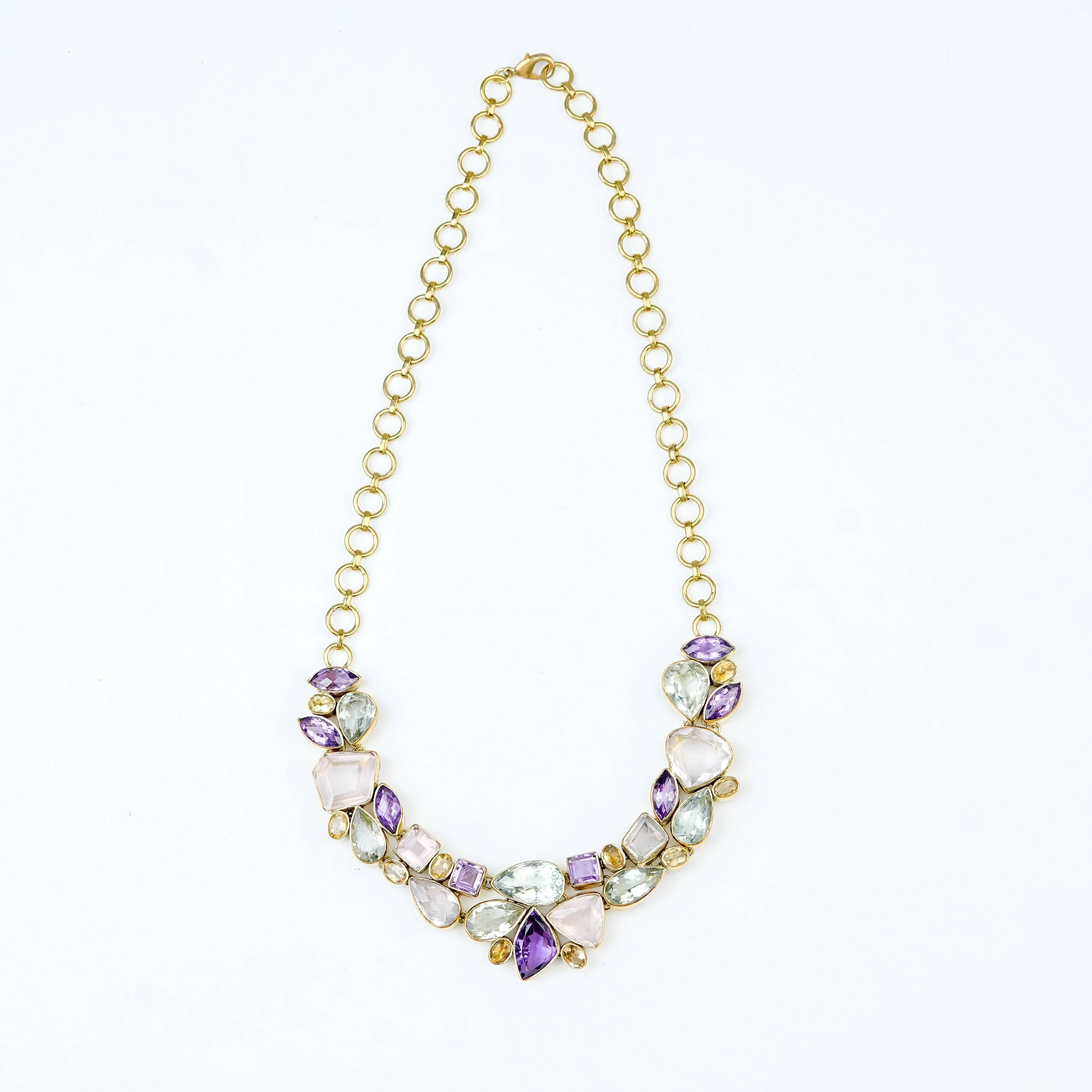 Detailed view of a brass fashion necklace highlighting intricate motifs, textured surface, and refined brass finish