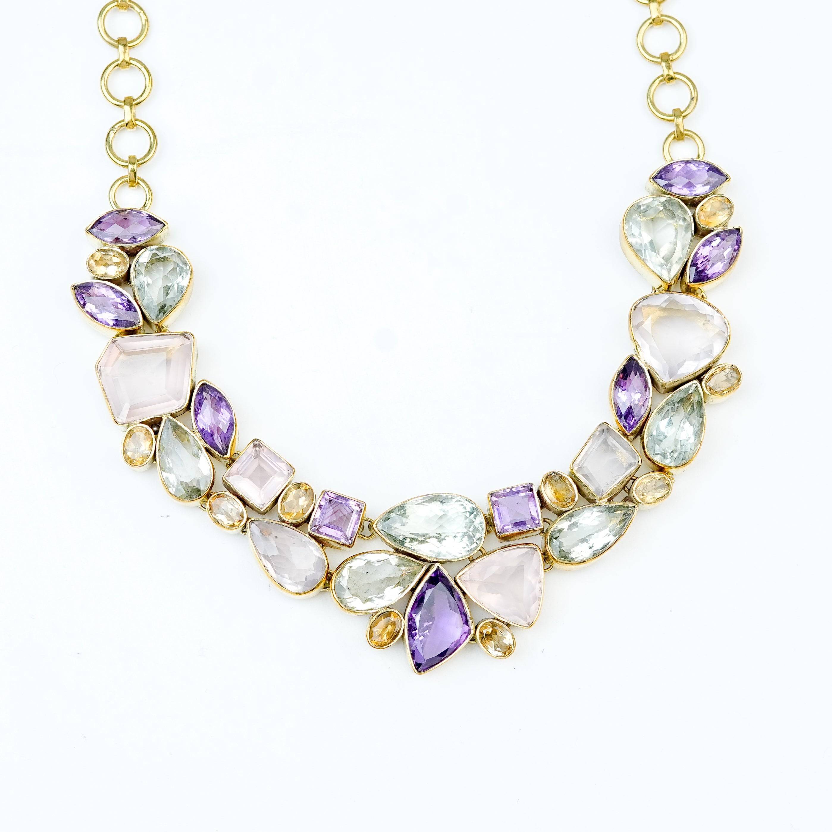 Close-up of a brass fashion necklace showcasing intricate detailing, textured elements, and fine craftsmanship