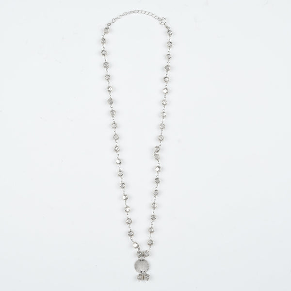 Flat-lay of Ashtapailu Necklace with a plain coin pendant with traditional accessories and elegant festive styling