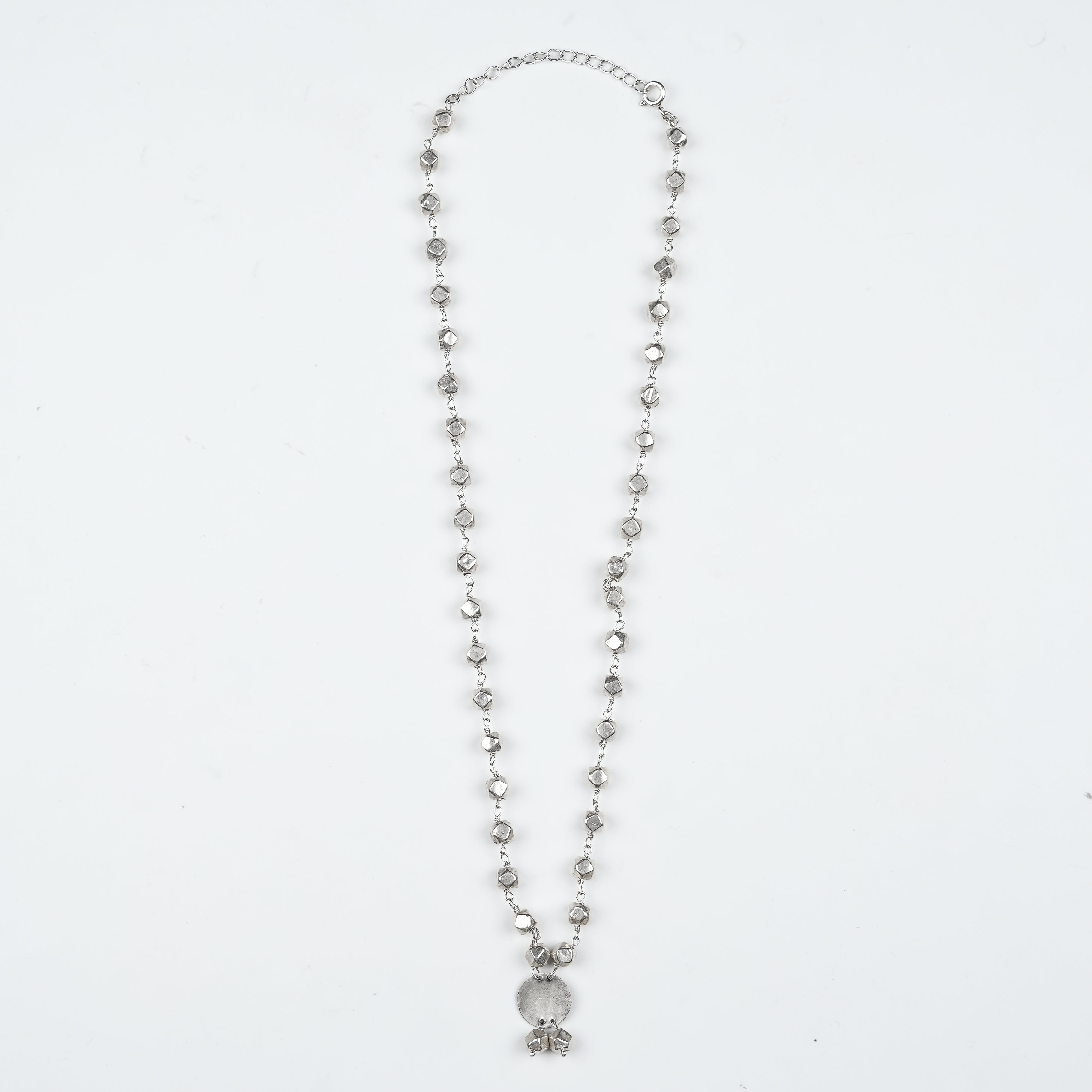 Flat-lay of Ashtapailu Necklace with Plain Coin Pendant (Small) with traditional accessories and elegant festive styling