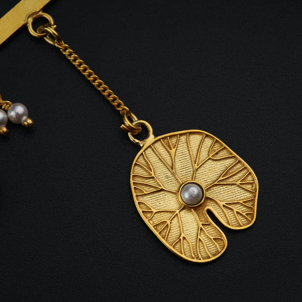 a close up of a necklace on a black surface