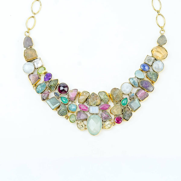 Close-up of a brass fashion necklace showcasing intricate detailing, textured elements, and fine craftsmanship