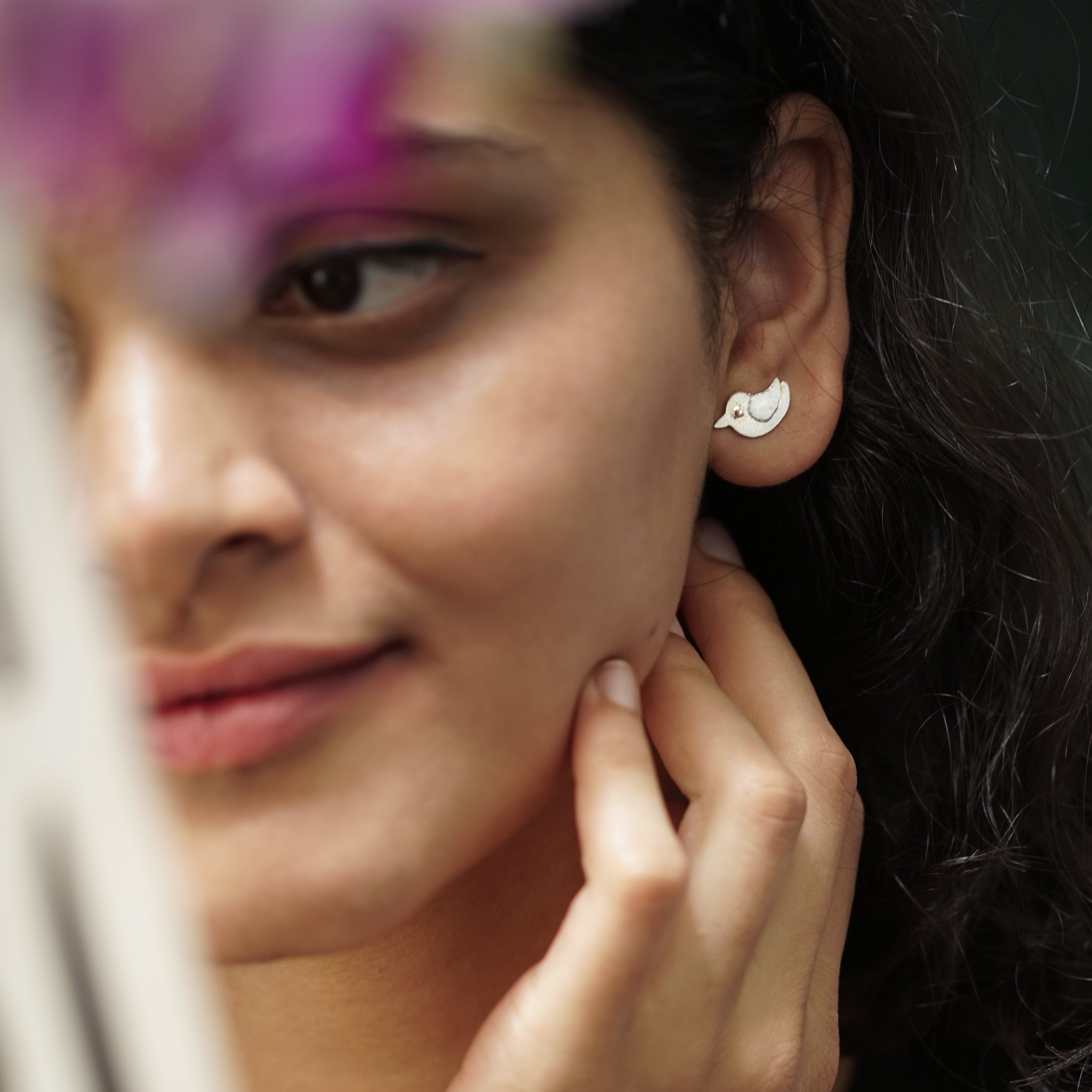 Handcrafted silver bird duo earrings close-up detailing