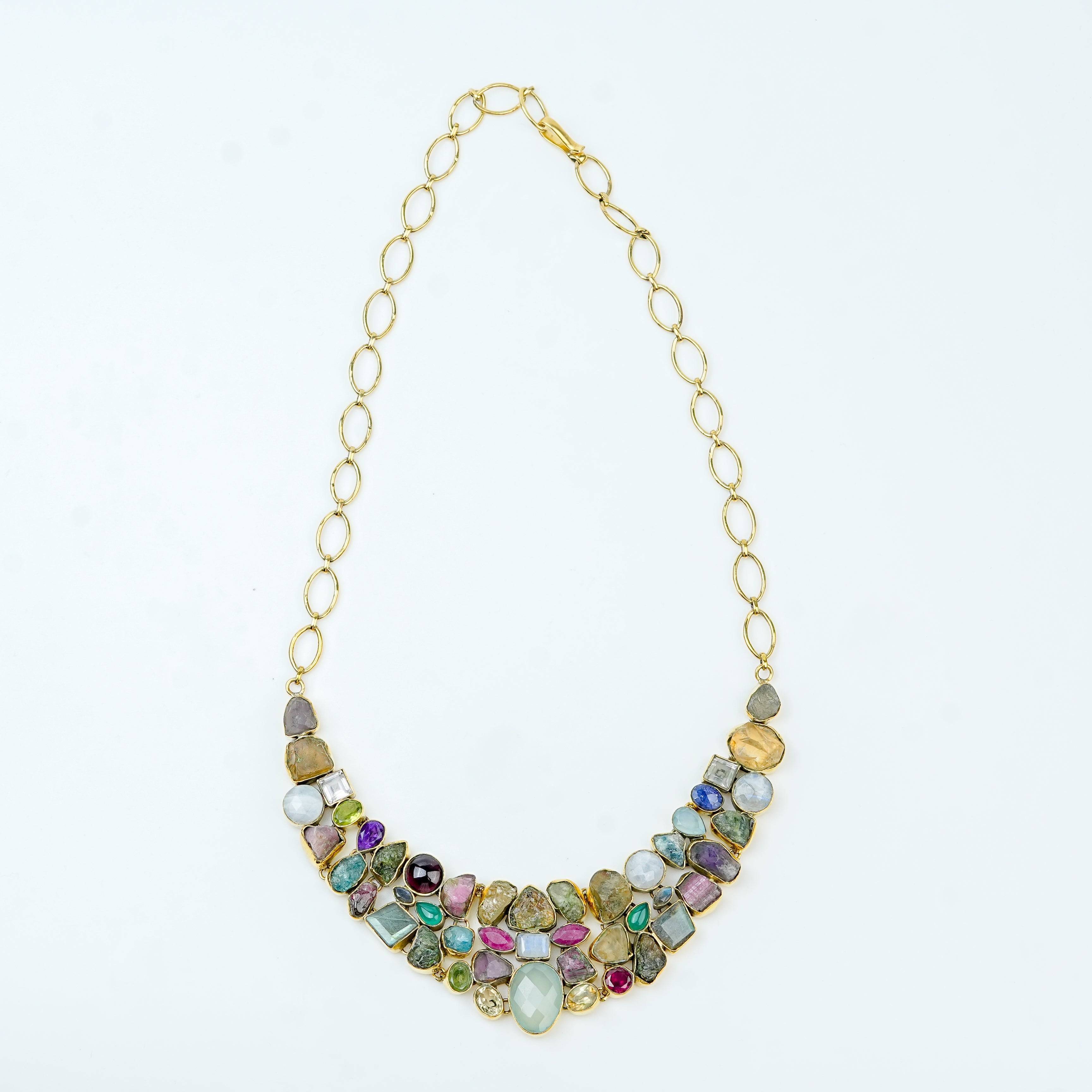 Detailed view of a brass fashion necklace highlighting intricate motifs, textured surface, and refined brass finish