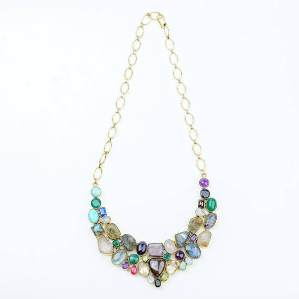 Detailed view of a brass fashion necklace highlighting intricate motifs, textured surface, and refined brass finish