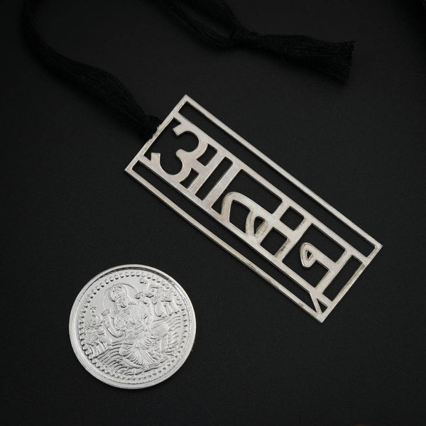 Black gift tag with silver 'BADDY' logo