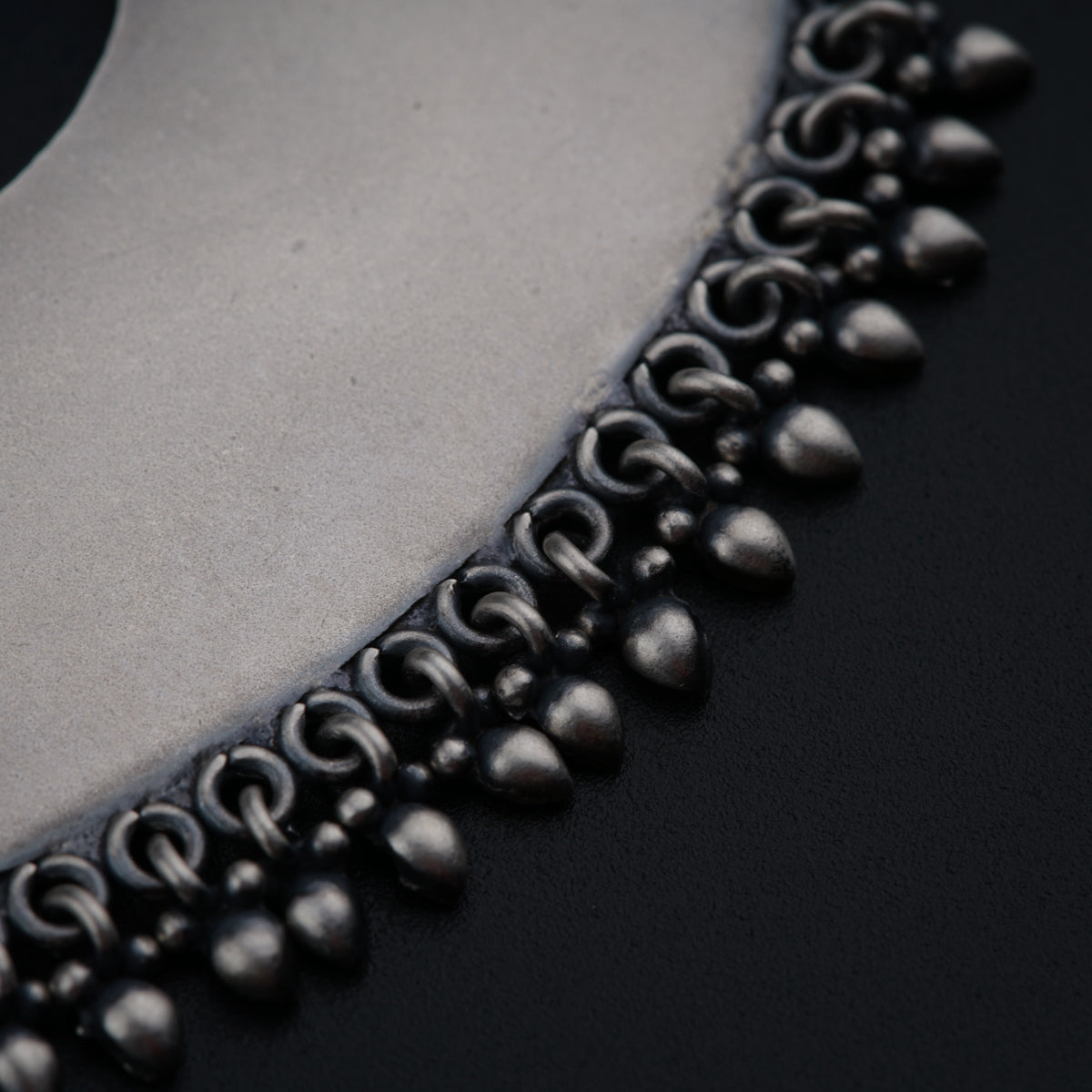 a close up of a black and silver object