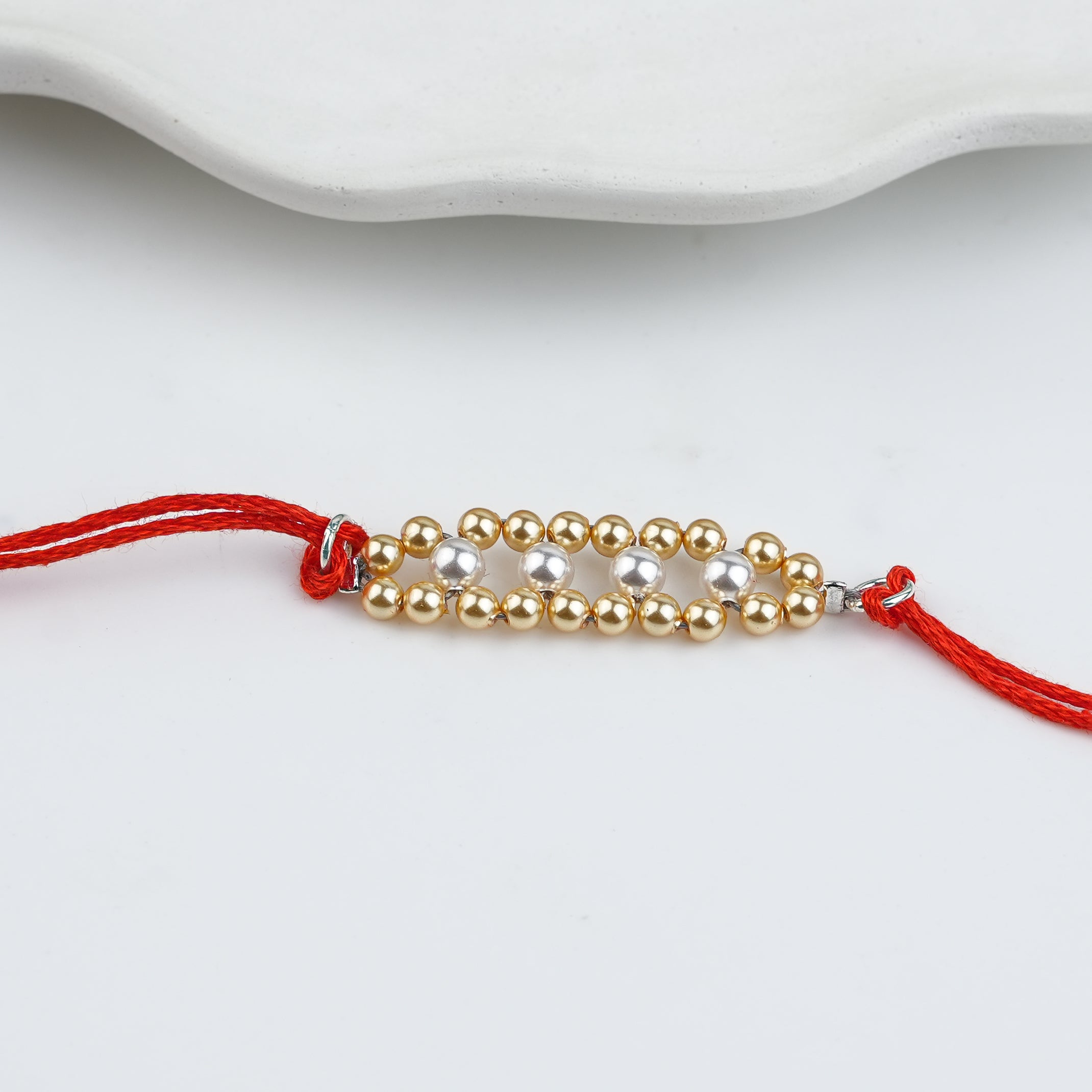 Golden & White Pearl Handmade Silver Rakhi