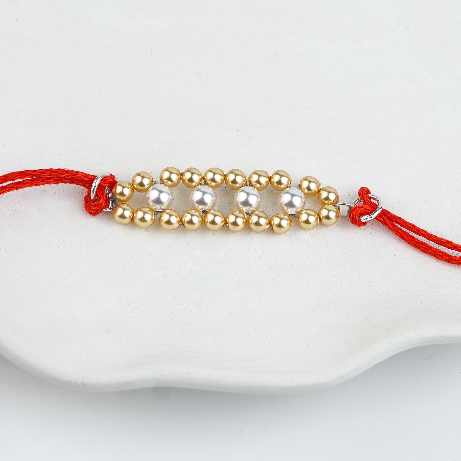 Golden & White Pearl Handmade Silver Rakhi