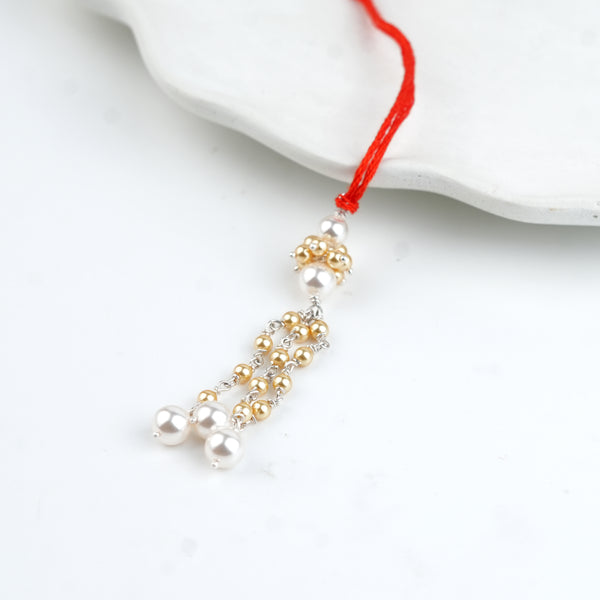Golden & White Pearl Handmade Silver Lumba Rakhi