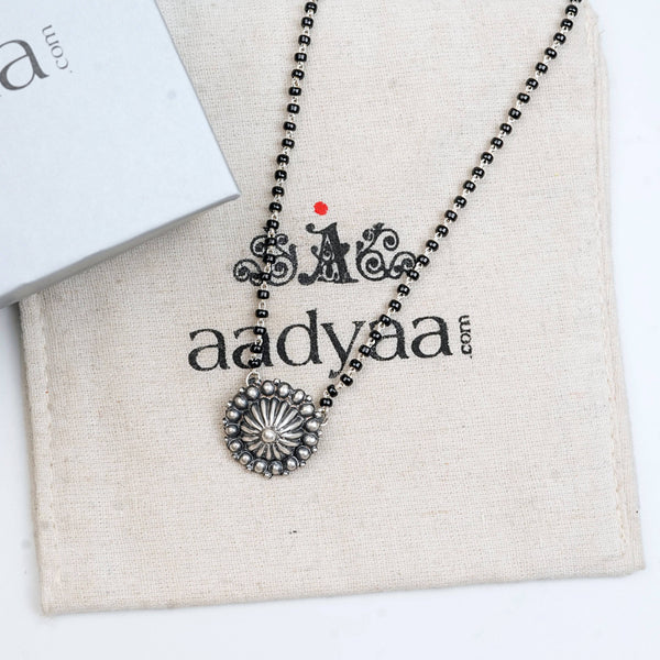 Model styling Silver Oxidized Dome Mangalsutra with an ethnic outfit for a timeless and elegant appearance