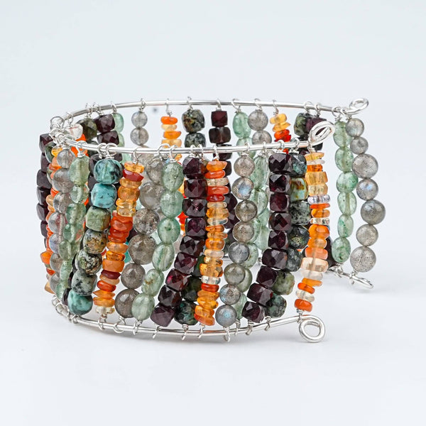 Angled view of a multicolour semi-precious stone silver bracelet in 92.5 sterling silver with colourful semi-precious stone detailing