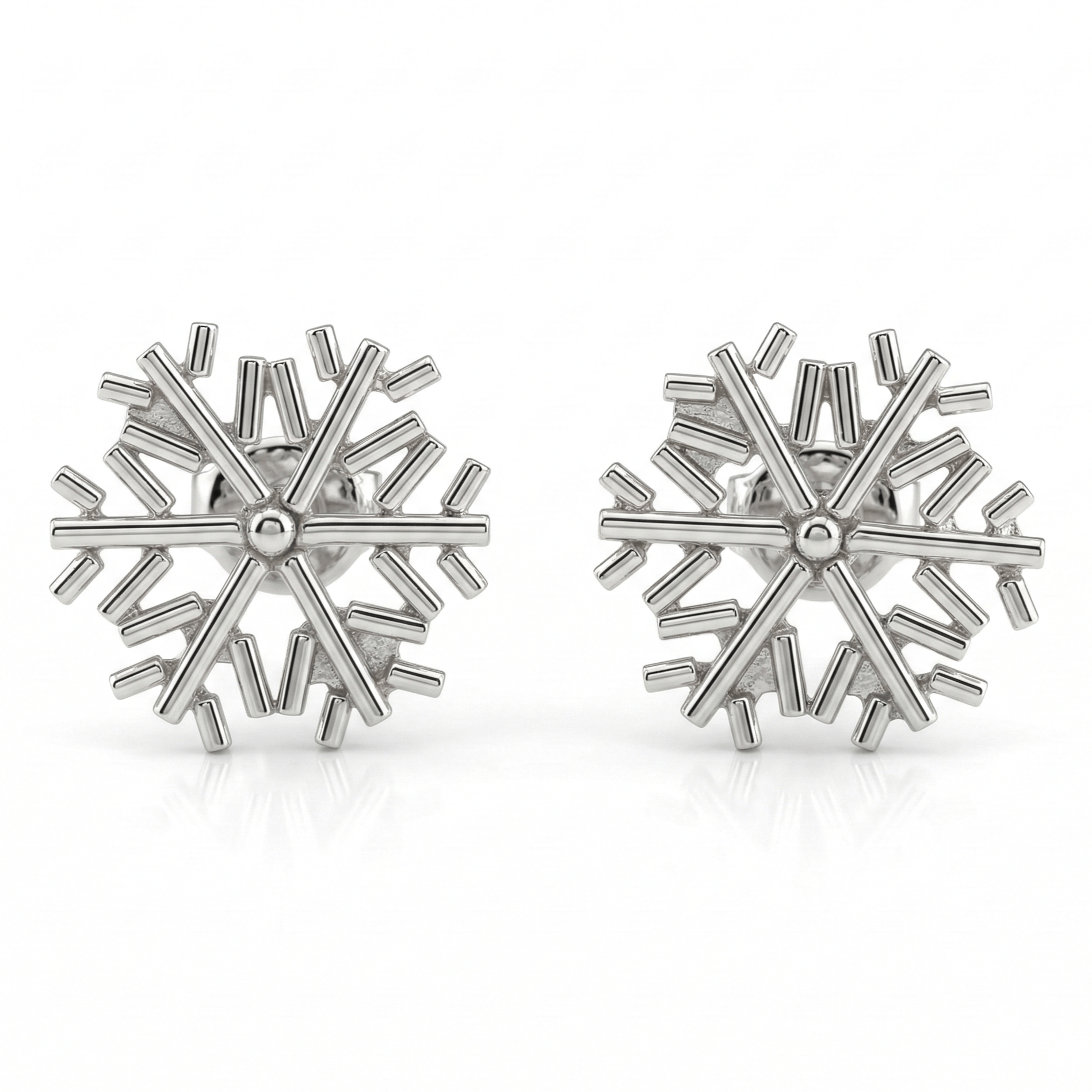 Silver snowflake earrings on white background