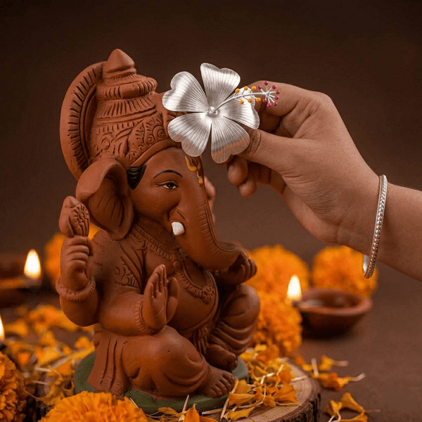 Terracotta Ganesha with flower for pooja
