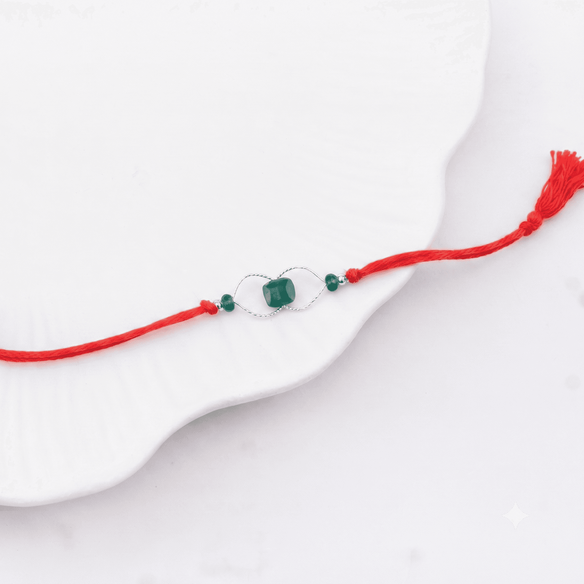 Traditional handcrafted silver Rakhi with green onyx gemstone