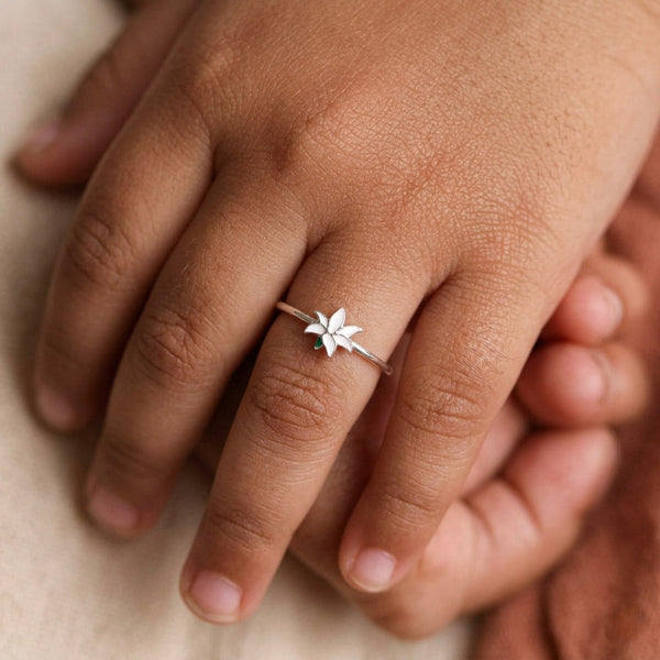 Model wearing White Lily enamel ring on finger