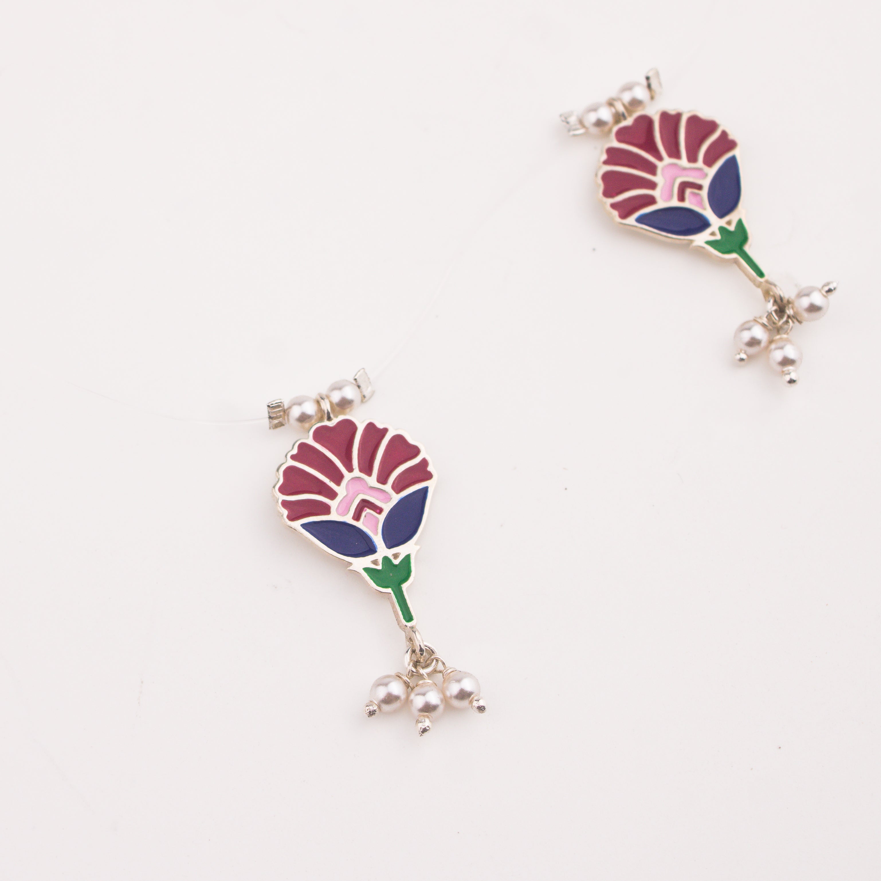 Meena charm set with invisible thread