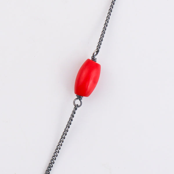 Detail shot of Saraswati motif and coral stone accents