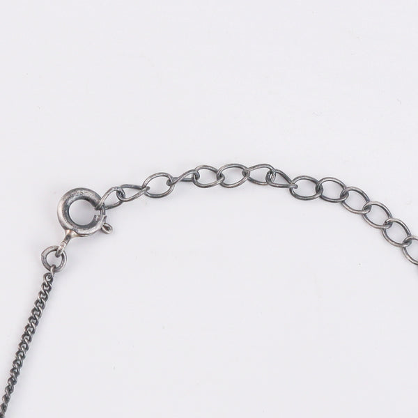 Detail shot of Saraswati motif and coral stone accents