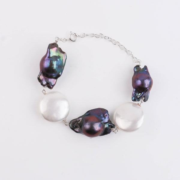 Model wearing pearl silver Ganthan bracelet for elegant and minimalist jewelry styling