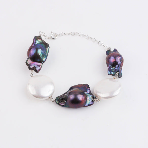 Macro detail of lustrous pearls with 92.5 sterling silver Ganthan links and finish
