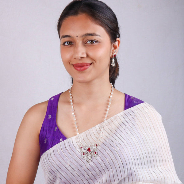 Model wearing Silver Pink & White CZ Tanmani Set with Pearl Ganthan for an elegant traditional jewellery look
