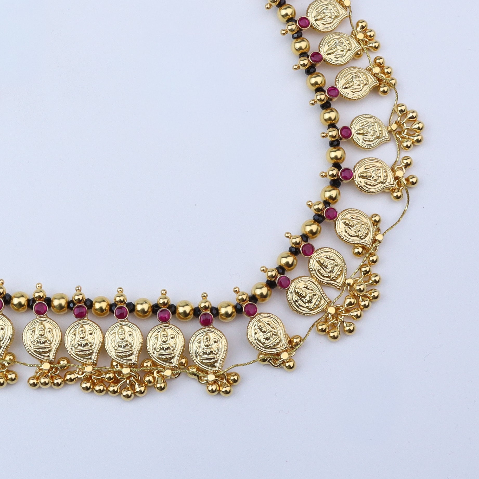 Gold plated Mango Saaj with black spinels and red stones jewelry
