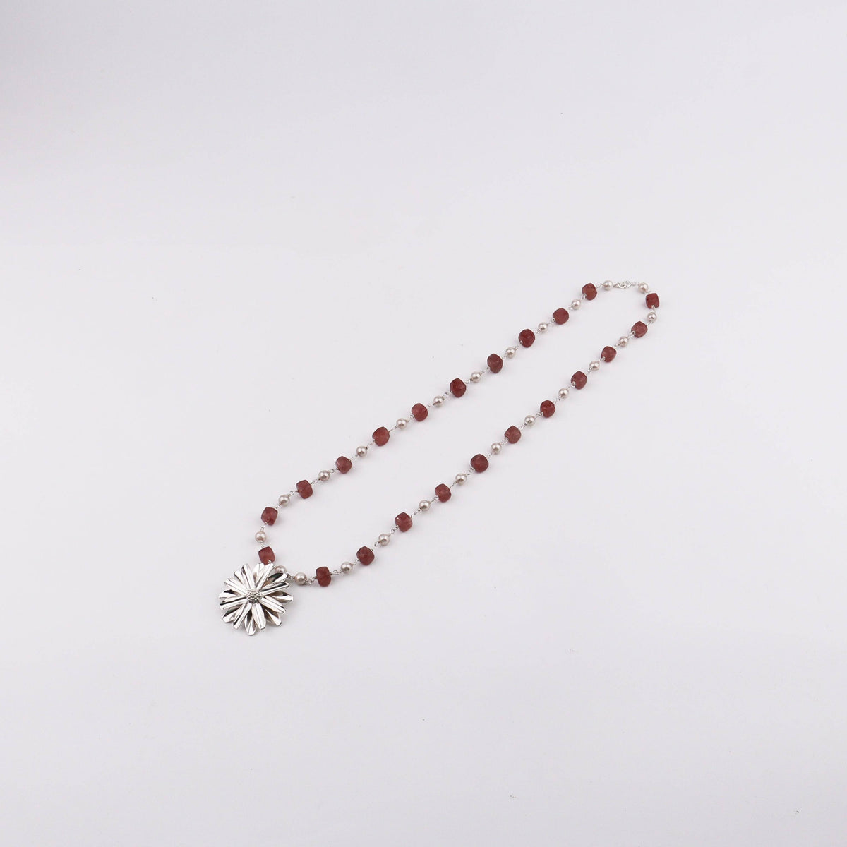 Model wearing Silver Soorajmukhi Pendant Pink Strawberry Cubes