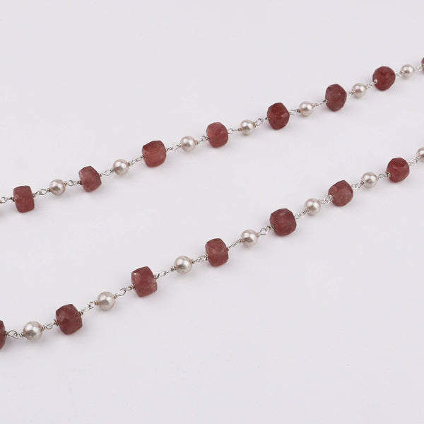 Flat lay of Silver Soorajmukhi Pendant Pink Strawberry Cubes