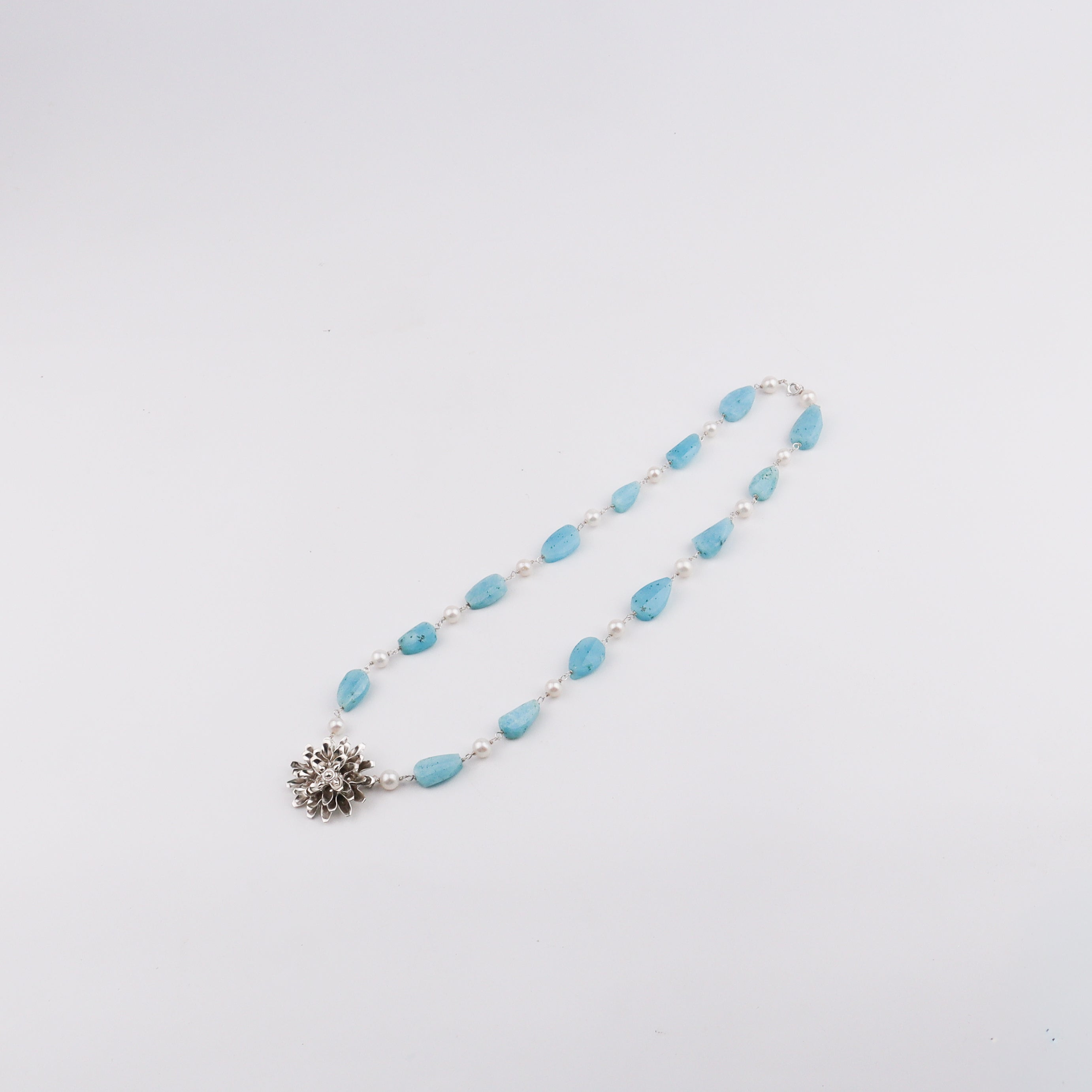 Silver Soorajmukhi Pendant Fancy Larimar Stones