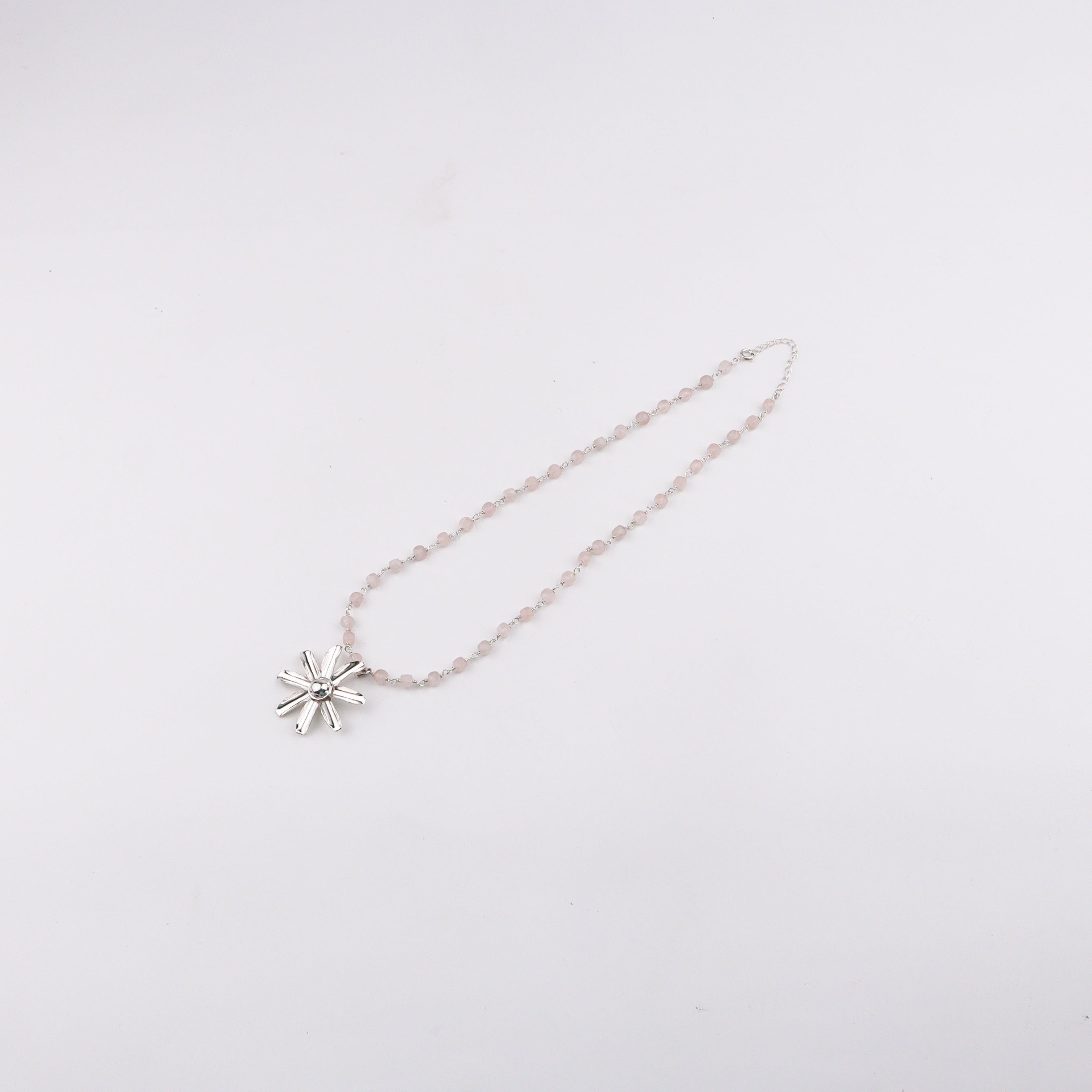 Woman styling Gulbahaar Necklace with Rose Quartz outfit