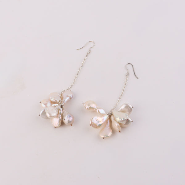 Close-up of Luxe Baroque Pearl Drop Earrings