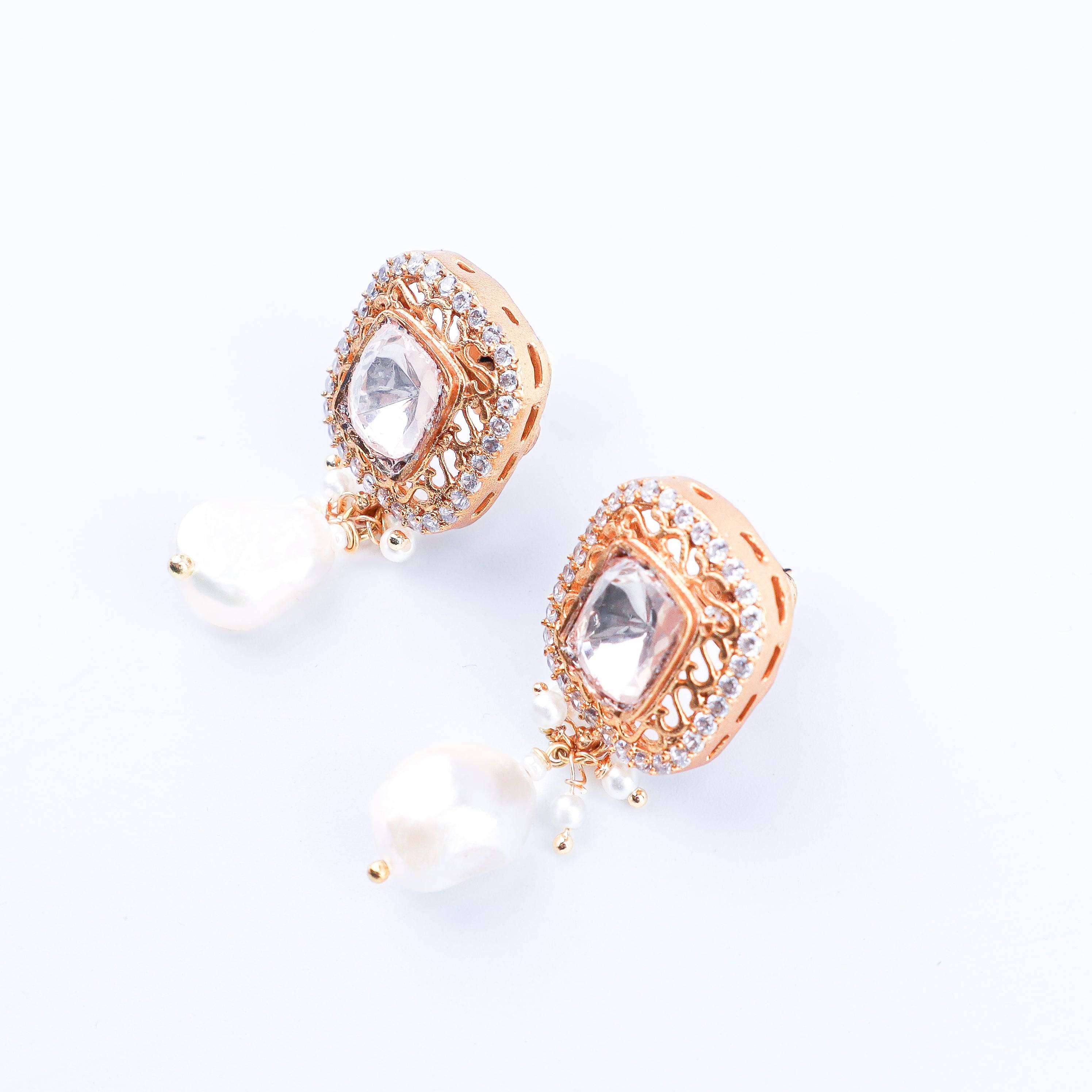Angled view of a 22K gold-plated fashion earring highlighting its elegant silhouette, structure, and polished gold finish