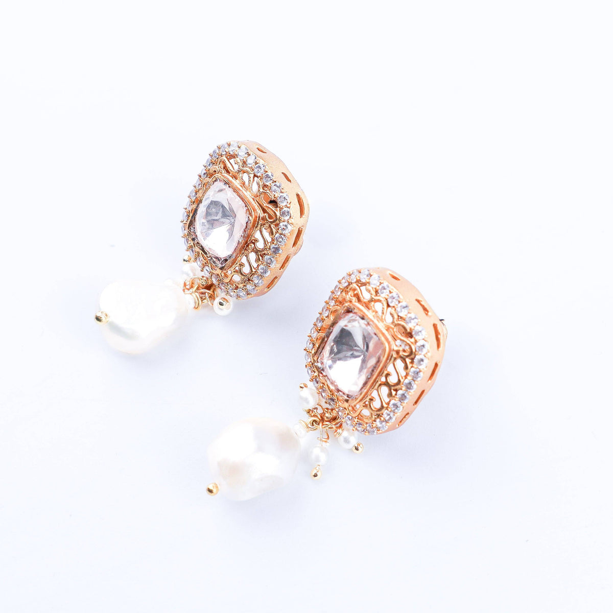 Angled view of a 22K gold-plated fashion earring highlighting its elegant silhouette, structure, and polished gold finish
