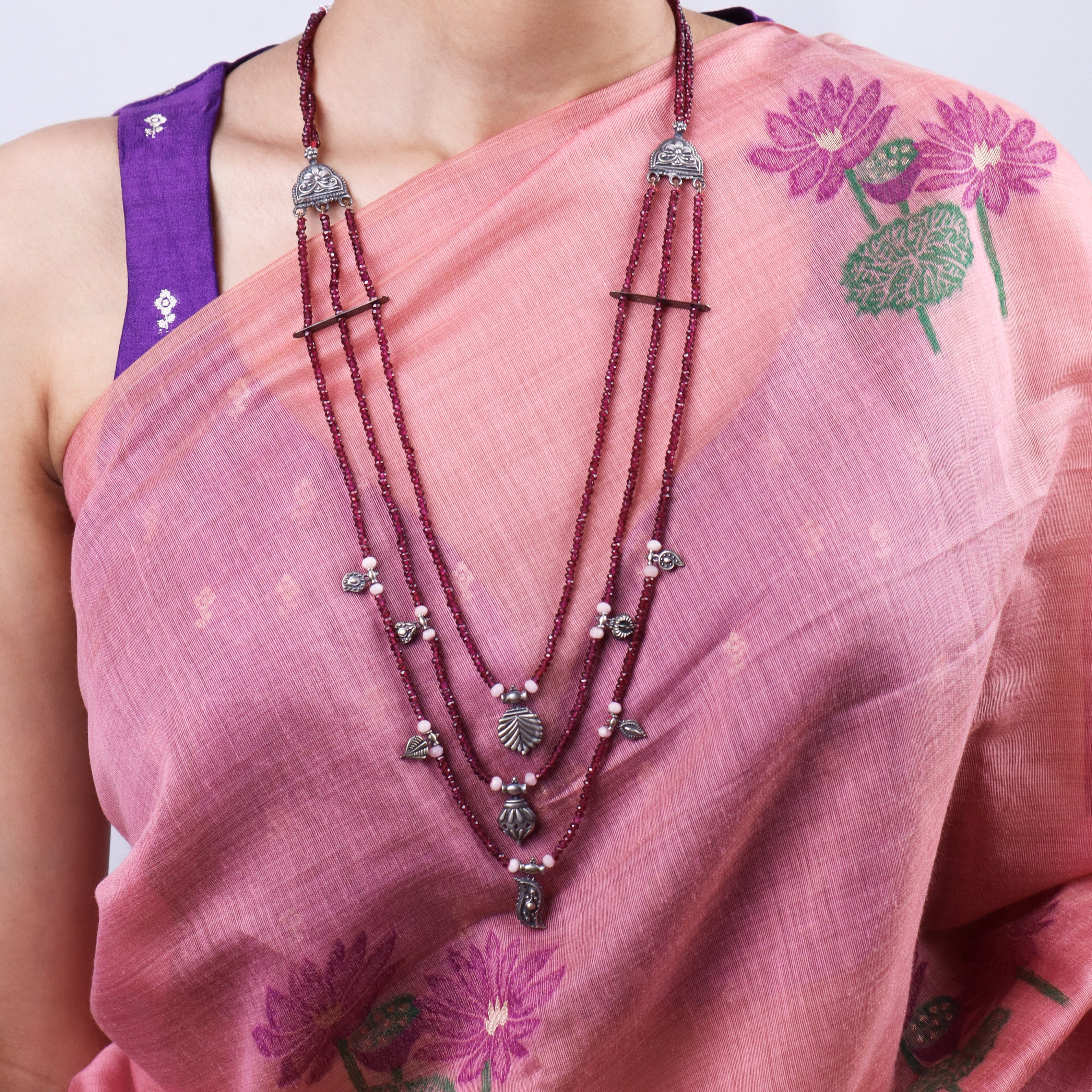 saaj motif detailing on silver satlada necklace