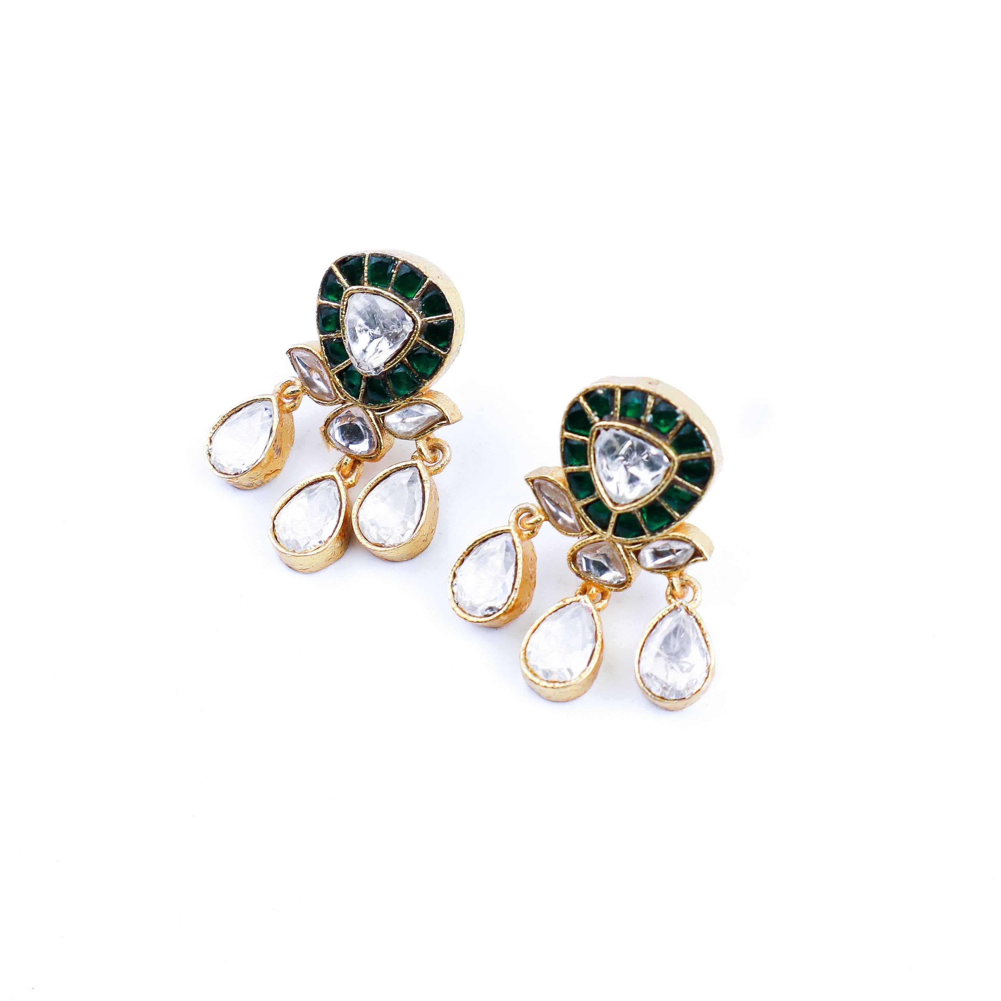 Angled view of a 22K gold-plated fashion earring highlighting its elegant silhouette, structure, and polished gold finish