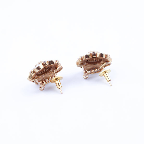 Angled view of a 22K gold-plated fashion earring highlighting its elegant silhouette, structure, and polished gold finish