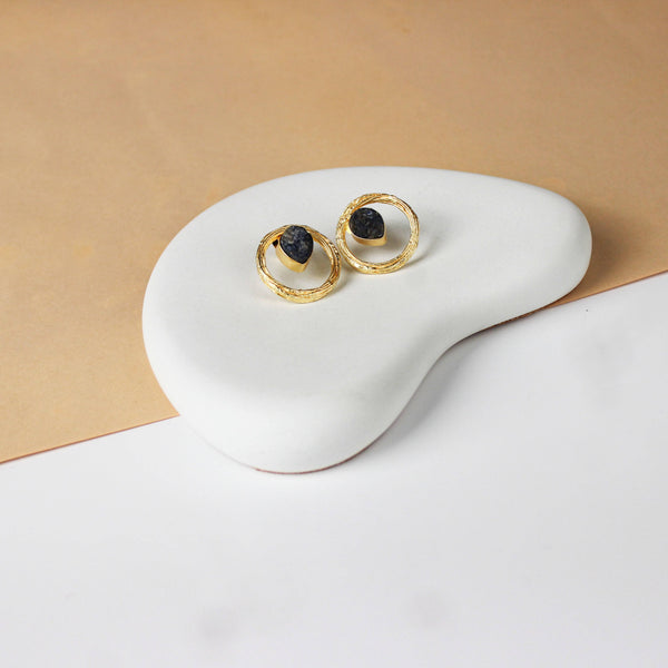 Angled view of a 22K gold-plated fashion earring highlighting its elegant silhouette, structure, and polished gold finish