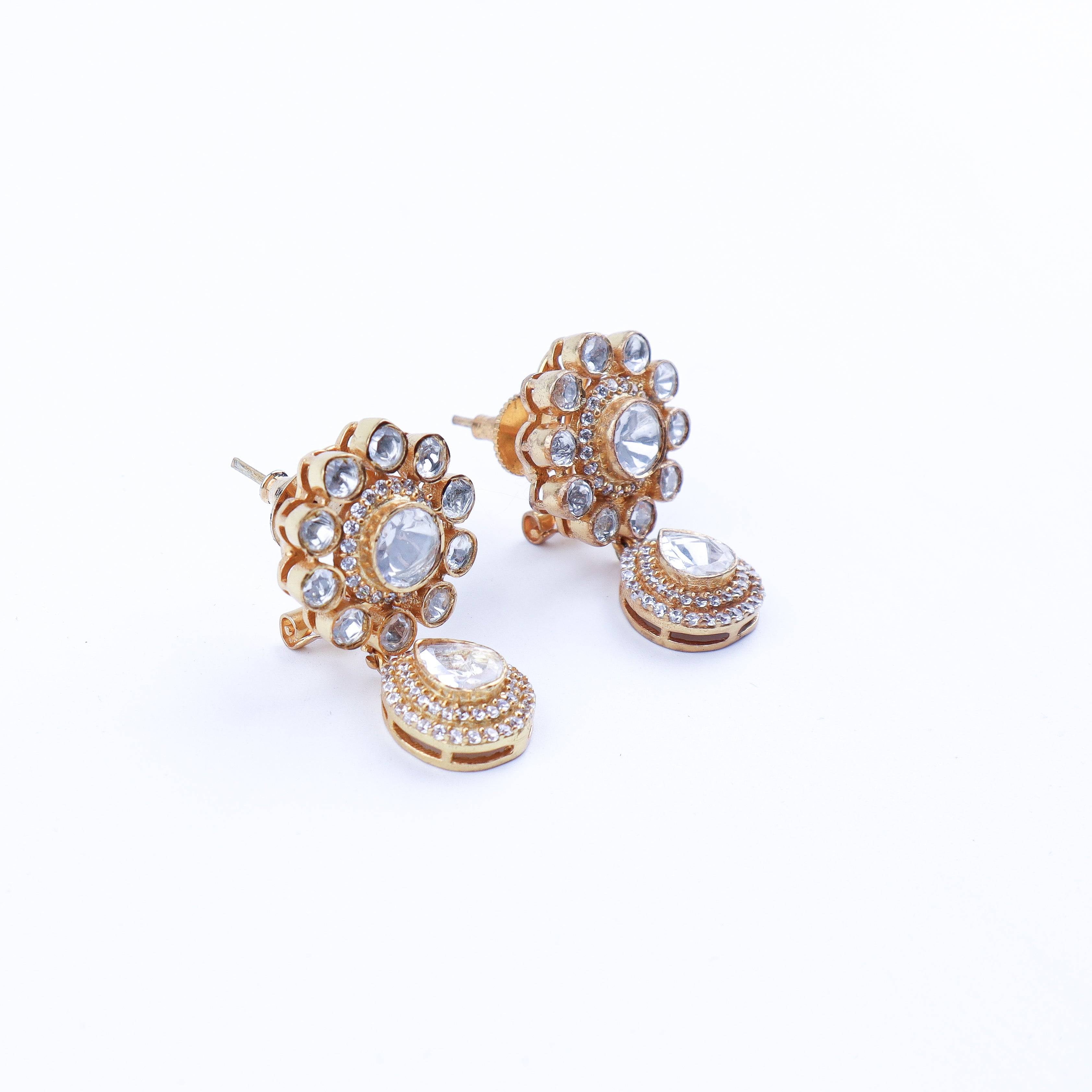 Angled view of 22K gold-plated fashion earring highlighting its elegant silhouette, structure, and polished gold finish