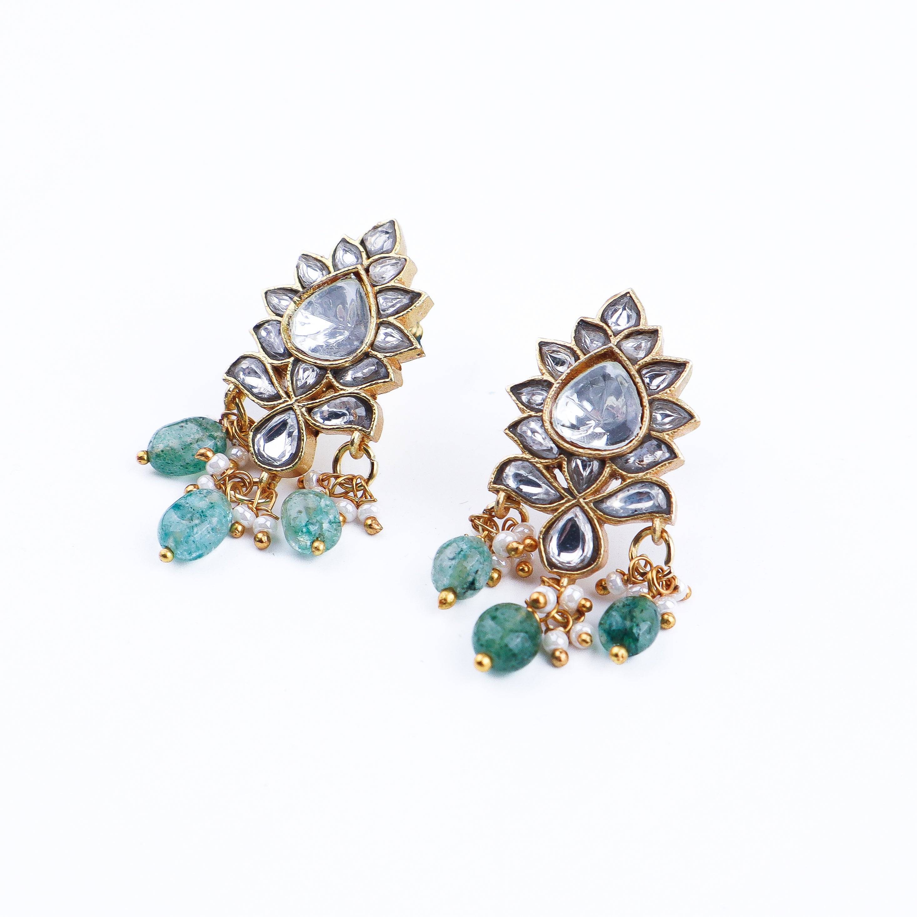 Angled view of a 22K gold-plated fashion earring highlighting its elegant silhouette, structure, and polished gold finish